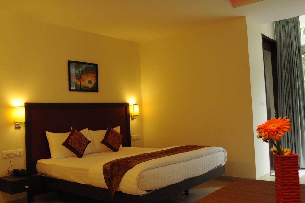 Ixora Suites Bengaluru Szoba fotó